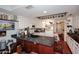 Cozy kitchen with white cabinets, black countertops, and hardwood flooring at 4317 N 70Th St, Scottsdale, AZ 85251