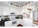 Functional kitchen with white appliances, cabinets, and a cheerful, bright feel at 4317 N 70Th St, Scottsdale, AZ 85251