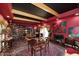 Eclectic living room with hardwood floors, colorful art, and many bookshelves at 4317 N 70Th St, Scottsdale, AZ 85251