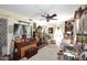 Inviting living room showcasing eclectic decor, wooden furniture, and a charming ceiling fan at 4317 N 70Th St, Scottsdale, AZ 85251