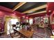 Elegant living room with a black ceiling, striking red walls, and ornate furnishings at 4317 N 70Th St, Scottsdale, AZ 85251