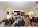 Cluttered living room featuring assorted furniture, wall art, and overflowing boxes obstructing the space at 4317 N 70Th St, Scottsdale, AZ 85251