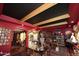 Elegant living room with black ceiling, striking red walls, hardwood floors, and tasteful decor at 4317 N 70Th St, Scottsdale, AZ 85251