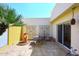 Outdoor patio with tiled flooring, potted plants, and wrought iron table with seating at 4317 N 70Th St, Scottsdale, AZ 85251
