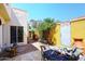 Secluded patio area featuring brick flooring, lush greenery, and outdoor seating at 4317 N 70Th St, Scottsdale, AZ 85251