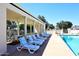 Community swimming pool with lounge chairs and covered seating area at 4317 N 70Th St, Scottsdale, AZ 85251