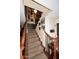 Elegant carpeted staircase adorned with unique decorations leads to upper level of the home at 4317 N 70Th St, Scottsdale, AZ 85251