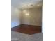 Elegant dining room with hardwood floors, a decorative chandelier, and ample space for entertaining at 4581 E Apricot Ln, Gilbert, AZ 85298