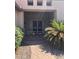 Inviting front entrance with a gated courtyard, desert landscaping, and an elegant pathway to the front doors at 4581 E Apricot Ln, Gilbert, AZ 85298