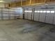 Spacious garage features overhead storage and built-in shelving for maximum organization and convenience at 4581 E Apricot Ln, Gilbert, AZ 85298