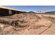 Construction site shows the dirt foundation for a new home in a residential neighborhood at 46850 W Old Timer Rd, Maricopa, AZ 85139
