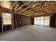 Living Room framing showing sliding door to backyard and window openings in an incomplete new home at 46850 W Old Timer Rd, Maricopa, AZ 85139