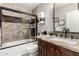 Bathroom featuring granite counter, glass-enclosed shower, and tile surround exudes modern elegance at 5110 E Mark Ln, Cave Creek, AZ 85331