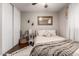 Neutral bedroom featuring comfortable bedding, white rug, and dark wood floors at 5110 E Mark Ln, Cave Creek, AZ 85331