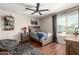 Comfortable bedroom with fan, window with blinders, and a twin bed at 5110 E Mark Ln, Cave Creek, AZ 85331