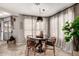 Cozy dining room with a round table, decorative lighting, and natural light at 5110 E Mark Ln, Cave Creek, AZ 85331