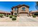 Attractive home with desert landscaping, a two-car garage, and well maintained yard at 5110 E Mark Ln, Cave Creek, AZ 85331
