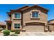 Two-story home with a two-car garage and desert landscaping at 5110 E Mark Ln, Cave Creek, AZ 85331