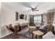 Bright living room with comfortable seating, large window, and fan at 5110 E Mark Ln, Cave Creek, AZ 85331