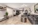Spacious living room features tile floors, neutral paint, stylish decor, and a staircase at 5110 E Mark Ln, Cave Creek, AZ 85331