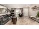 Inviting living room boasts tile floors, neutral paint, ample natural light, and stylish decor at 5110 E Mark Ln, Cave Creek, AZ 85331