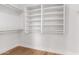 Walk-in closet with multiple shelves, rods, and bright white paint at 5125 W Wickiup Ln, Glendale, AZ 85308