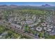 Wide aerial view of residential neighborhood, golf course, and mountain views showcasing the community's location at 5203 N 24Th St # 207, Phoenix, AZ 85016