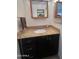 Bathroom featuring granite counters and a vanity with matching mirrored cabinet at 5203 N 24Th St # 207, Phoenix, AZ 85016