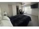 View of carpeted bedroom featuring a queen size bed, desk and ceiling fan at 5203 N 24Th St # 207, Phoenix, AZ 85016