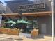 Close-up of the Bisutoro Sushi Bar exterior showcasing modern design and outdoor seating at 5203 N 24Th St # 207, Phoenix, AZ 85016