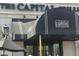 Entrance to The Capital Grille showing black awning, ornate lamp and umbrella covered outdoor dining at 5203 N 24Th St # 207, Phoenix, AZ 85016