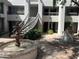 Relaxing courtyard featuring a water fountain, seating, and access to units via exterior staircases at 5203 N 24Th St # 207, Phoenix, AZ 85016