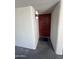 Inviting condo entrance featuring a red front door with stylish black hardware, and a welcome mat at 5203 N 24Th St # 207, Phoenix, AZ 85016