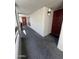 Inviting condo entrance featuring a red front door with stylish black hardware, and a welcome mat at 5203 N 24Th St # 207, Phoenix, AZ 85016
