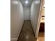 Neutral hallway with tile floor, leading to additional rooms and bathroom with vanity at 5203 N 24Th St # 207, Phoenix, AZ 85016