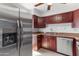 Modern kitchen showcasing stainless steel appliances, granite countertops, and sleek dark wood cabinetry at 5203 N 24Th St # 207, Phoenix, AZ 85016