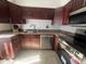 Stylish kitchen featuring granite countertops, stainless steel appliances, and wood cabinetry at 5203 N 24Th St # 207, Phoenix, AZ 85016