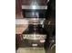 Stainless steel oven and microwave with cherry wood cabinets for kitchen storage at 5203 N 24Th St # 207, Phoenix, AZ 85016