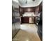 Updated kitchen features stainless steel appliances, rich wood cabinetry and granite countertops at 5203 N 24Th St # 207, Phoenix, AZ 85016