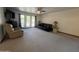 Spacious living room with ample seating, natural light from large windows, and neutral carpeting at 5203 N 24Th St # 207, Phoenix, AZ 85016