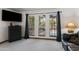 Bright living room with large windows offering a view of the pool and outdoor scenery at 5203 N 24Th St # 207, Phoenix, AZ 85016