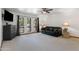 Spacious living area featuring a modern entertainment setup, large windows, and comfortable seating at 5203 N 24Th St # 207, Phoenix, AZ 85016