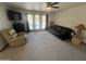 Spacious living room with ample seating, natural light from large windows, and neutral carpeting at 5203 N 24Th St # 207, Phoenix, AZ 85016