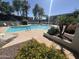 Beautifully landscaped pool area with mature trees and a variety of colorful flowers and plants that enhance the outdoor space at 5203 N 24Th St # 207, Phoenix, AZ 85016