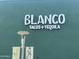 An image of the Blanco Tacos + Tequila sign on a green building at 5203 N 24Th St # 207, Phoenix, AZ 85016