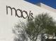 Macy's store sign with a green tree in front of the building at 5203 N 24Th St # 207, Phoenix, AZ 85016