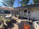 Exterior view of the charming teahouse with a seating area on a sunny day at 5203 N 24Th St # 207, Phoenix, AZ 85016