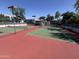 Well-maintained tennis courts offer a great amenity for active residents, with a red and green playing surface at 5203 N 24Th St # 207, Phoenix, AZ 85016