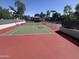 Well-maintained tennis courts offer a great amenity for active residents, with a red and green playing surface at 5203 N 24Th St # 207, Phoenix, AZ 85016
