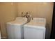 Functional laundry room with washer and dryer hookups at 5529 W Zoe Ella Way, Glendale, AZ 85306